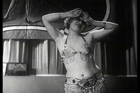 1930s - Famous dancers of the burlesque stage exhibit their strippers in a 1930s stag film.