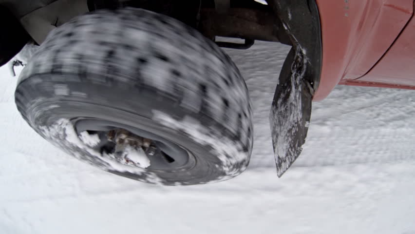 Heavy duty 4x4 tires driving through snow