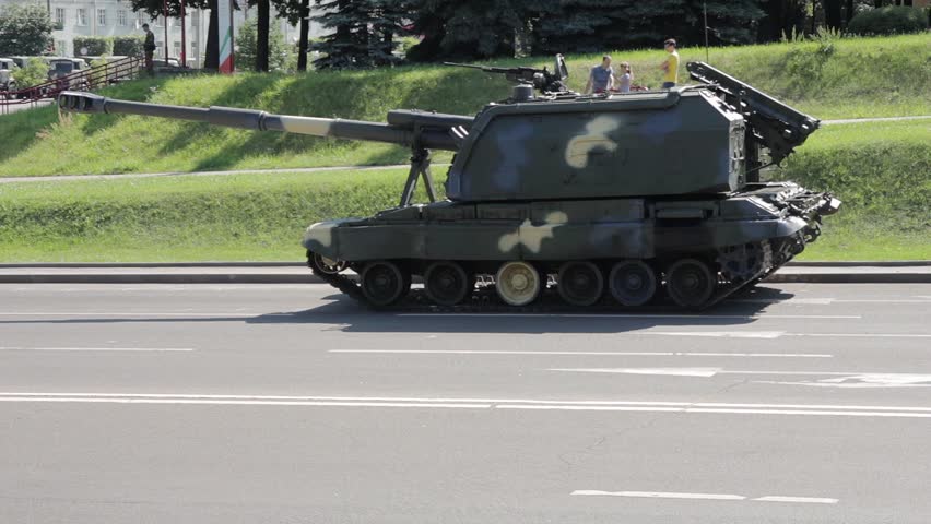 Big tank is on the city street. Camera smooth motion