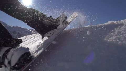 SLOW MOTION: Snowboarding jumping on a kicker