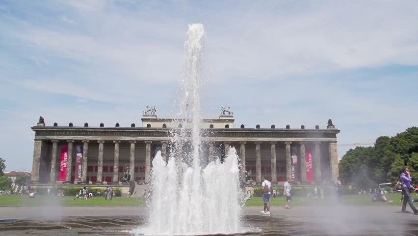 Fountain in pleasure garden and old museum in Berlin