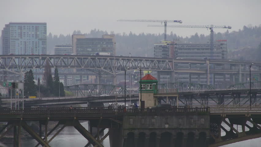 An ambulance and car traffic over two Portland, Oregon bridges