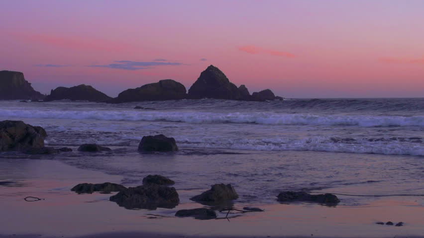 Waves crashing to the beach after sunset on the Oregon Coast 