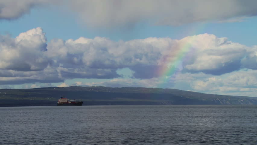 Oil Tanker and Rainbow on Cloudy Day