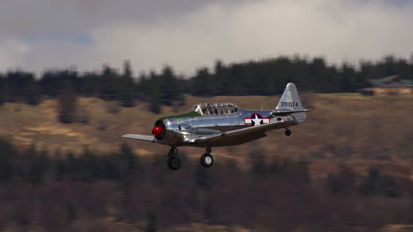 HOMER, AK - MAY 2013 - Functional vintage restored World War 2 aircraft descends