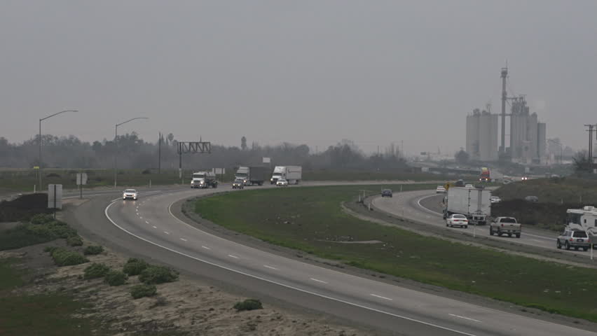 LIVINGSTON, CA - FEBRUARY 2013 - Traffic moves on Highway 99 on a foggy, gloomy