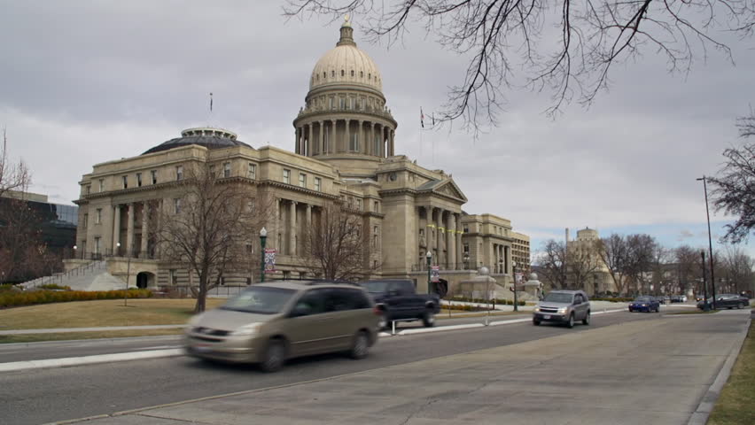 BOISE, ID - MARCH 2013 - Cars drive past the Idaho State Capitol Building on an