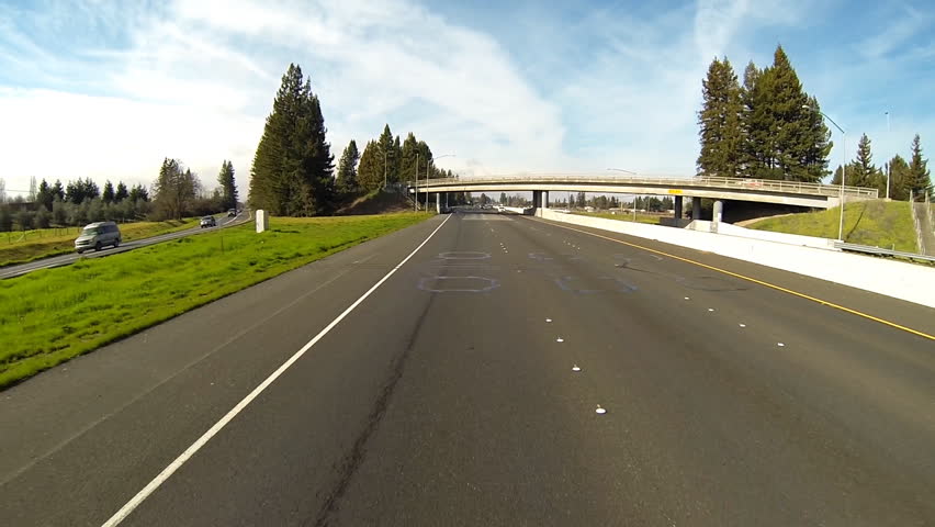 SANTA ROSA, CA - FEBRUARY 2013 -Traffic drives on Highway 101 on a sunny day in