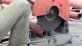 Heavy industry worker cutting steel