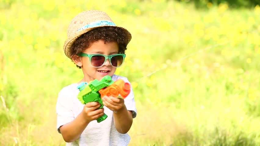 kid with water gun