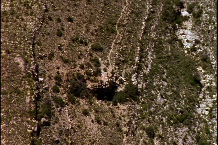 Aerial over entrance to Lechiguilla Cave in Carlsbad Caverns National Park, New Mexico.