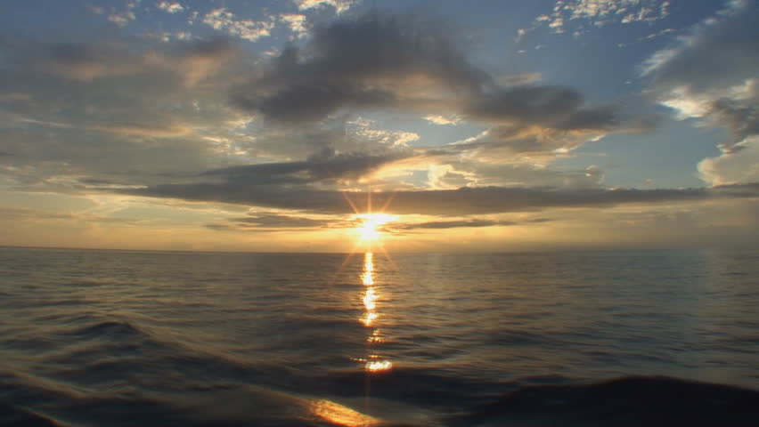 sunset seen from boat, pacific ocean