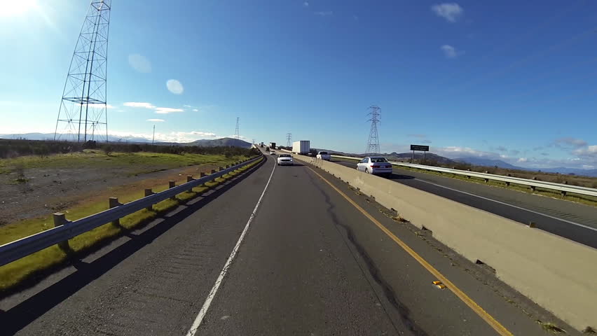 VALLEJO, CA - FEBRUARY 2013 - View of cars and trucks driving east on a rural
