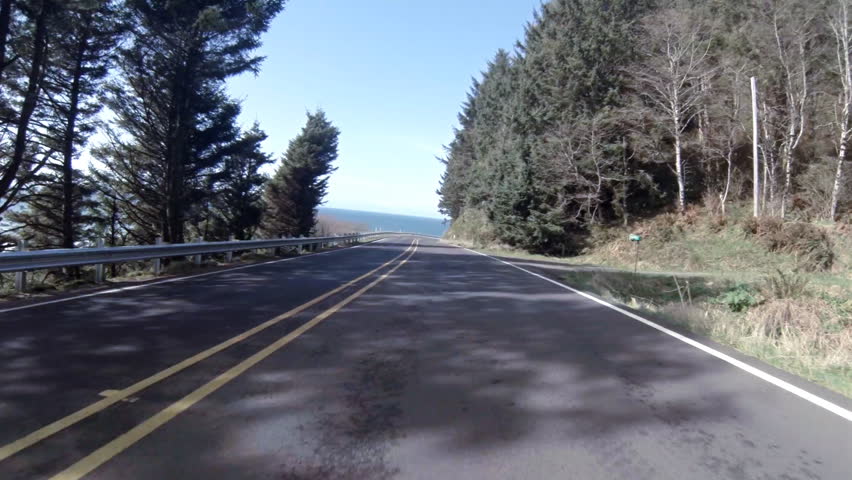 YACHATS, OR - UNKNOWN - Driving north on a sunny day beside the Pacific Ocean on