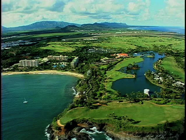 Aerial footage of a beautiful Hawaiian bay on the island of Kauai.