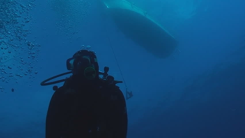 scuba diver and boat, under water