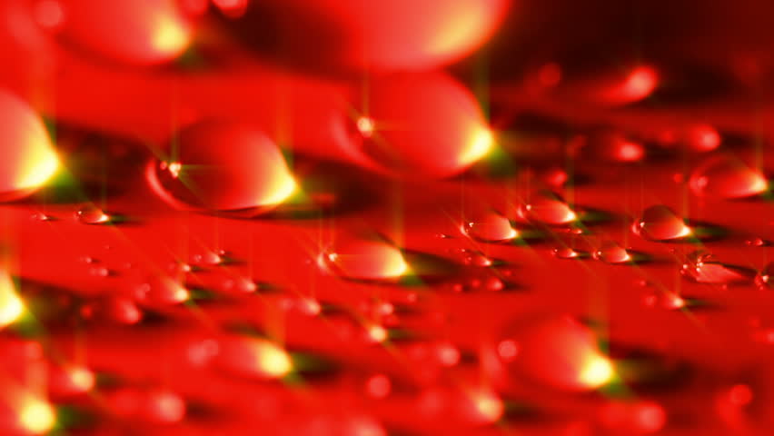 Large drops of water. Close-up. Tinted in red