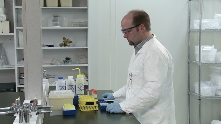 Male scientist inspecting results of work in a laboratory.
