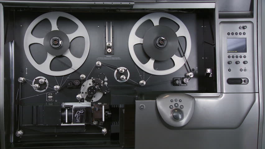 Telecine machine scanning and digitizing a 35mm film print in a movie