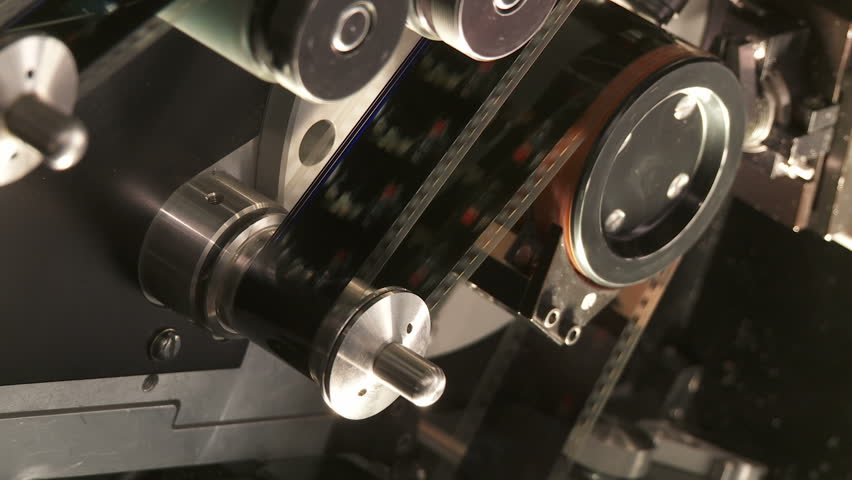 35mm film moving through a telecine machine, which digitizes the images and