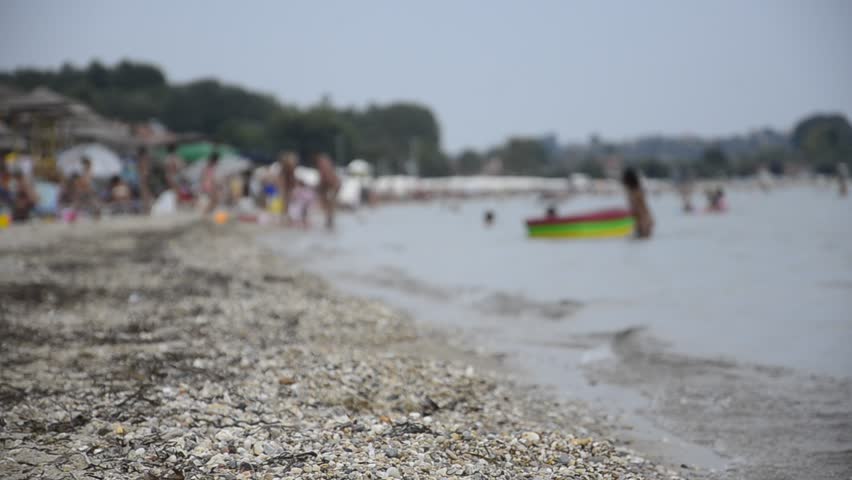 Sandy Beach, Focus on sand with blurred people activities on background