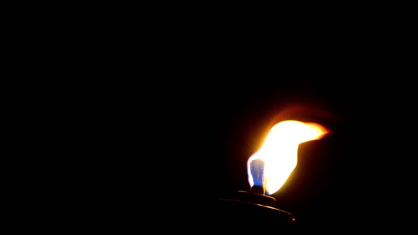 Flaming torch on black background. Copyspace available