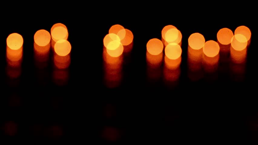 Abstract lights. Amazing candle light bokeh, particles of candles sway and move