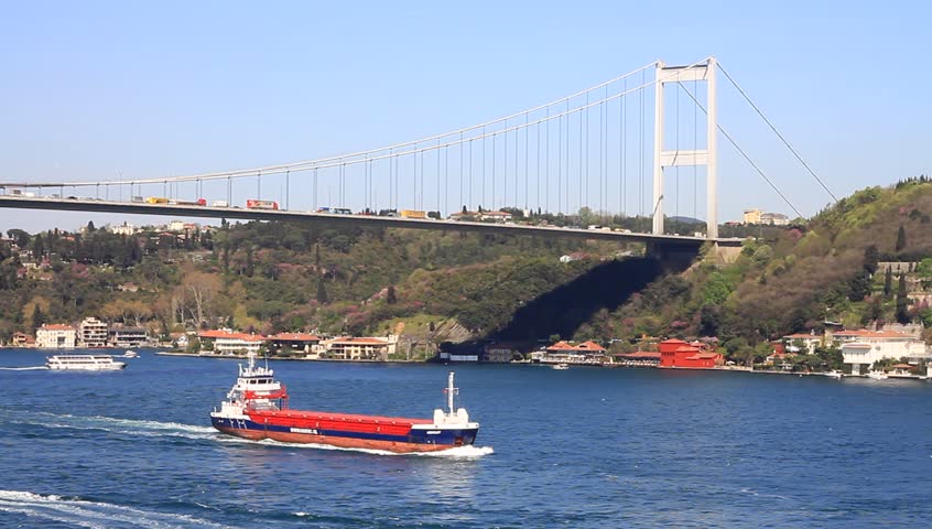 Tanker ship cruising under the bridge. Bosphorus Sea, Istanbul, Turkey
