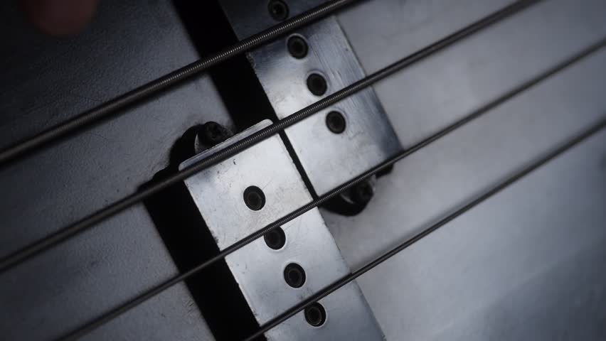 Close up of bass guitar player
