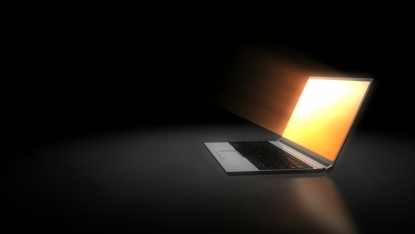 Laptop screen glowing.
