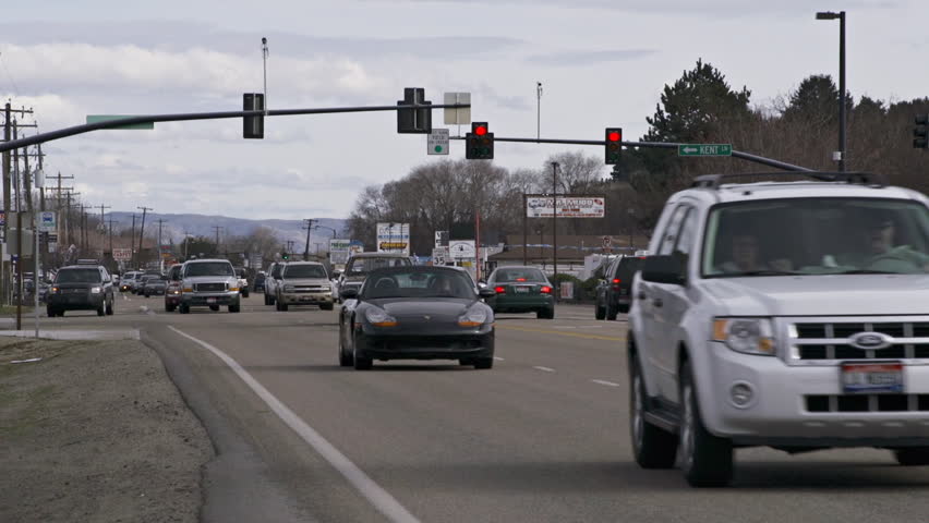 BOISE, ID - MARCH 2013 - Cars drive in traffic at a busy intersection on a