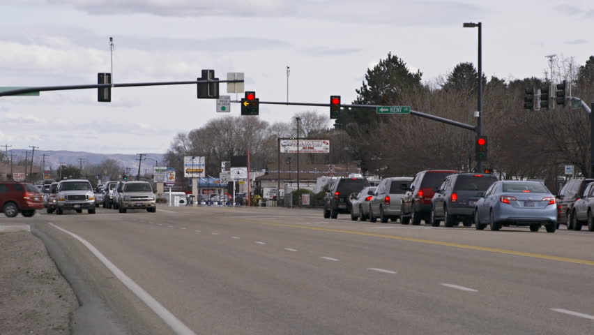 Boise, ID - MARCH 2013 - A police cruiser passes stopped traffic at an