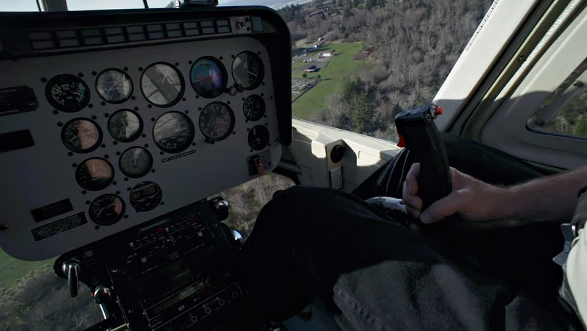 View from the passenger seat of a helicopter of the control panel as it is