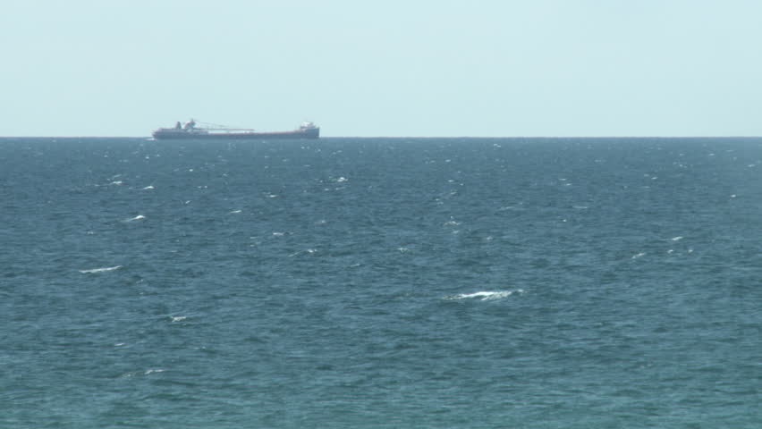 Container ship sailing through the Great Lakes Shipping Channel on Lake