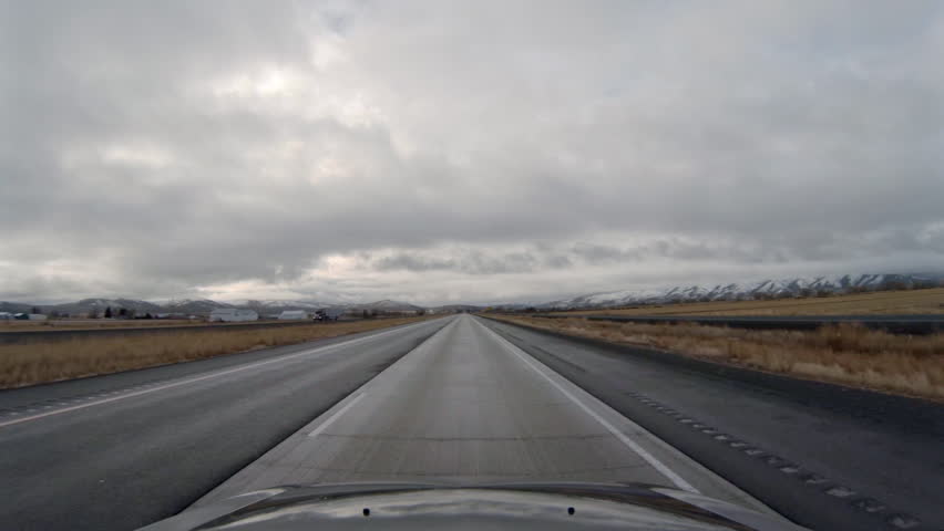 View driving southbound on Interstate 84 in Oregon under stormy, cloudy