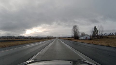 POV driving towards Boise, Idaho on Interstate 84 on a cloudy day in Oregon pov 