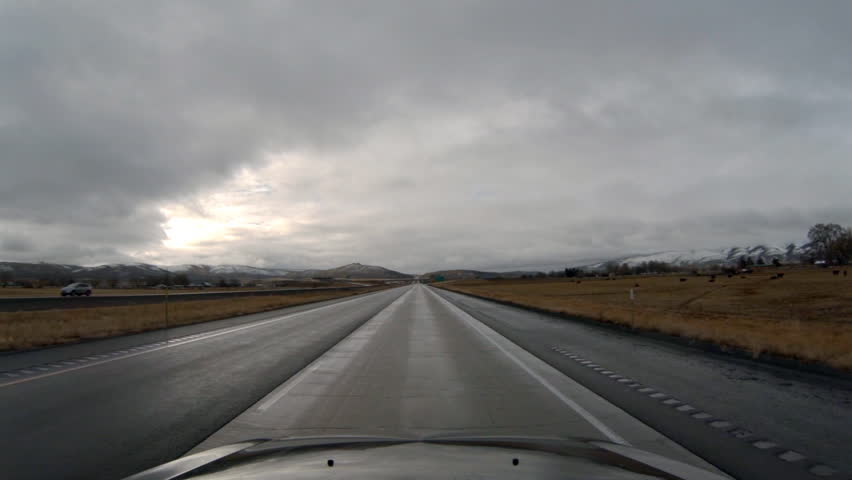 Driving view through windshield on Interstate 84 in Oregon southbound towards