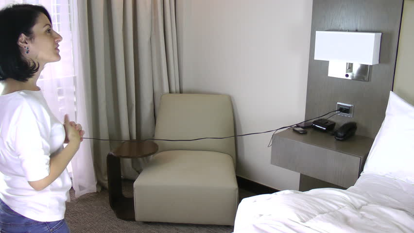 Smiling woman in her home. She just got her new home. Happy in the bedroom. 