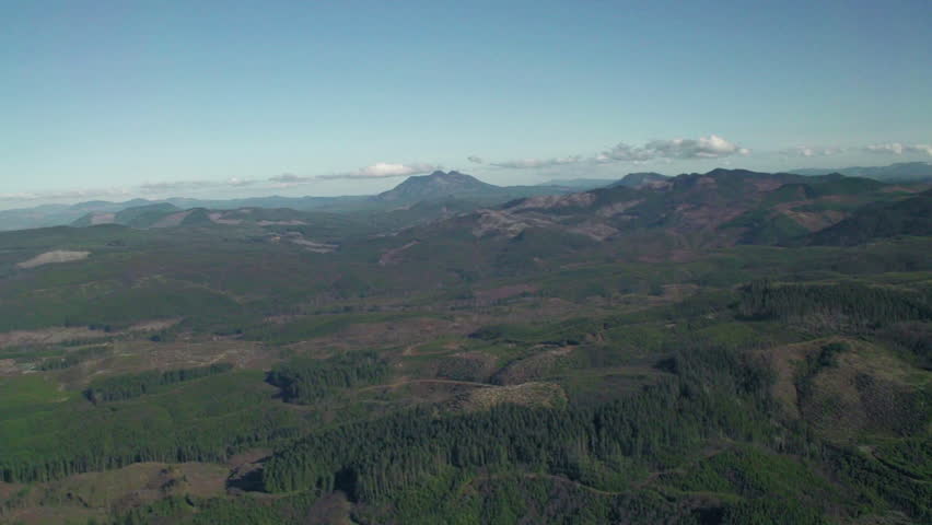 Aerial view of deforestation and logging evidence in hills near Seaside, Oregon
