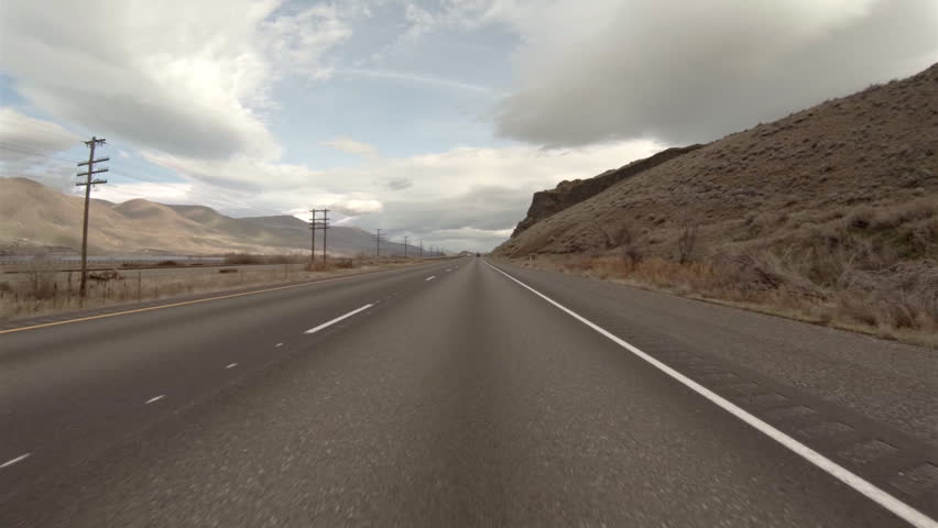 Scenic view of desert Oregon wilderness driving on Interstate 84 POV