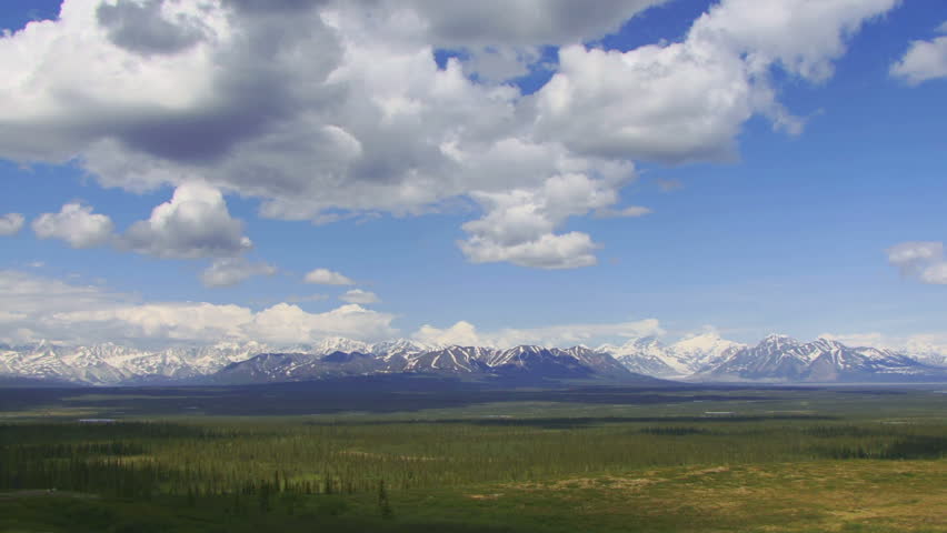 Slow time lapse of scenic Alaskan interior tundra prairie dotted with lakes and