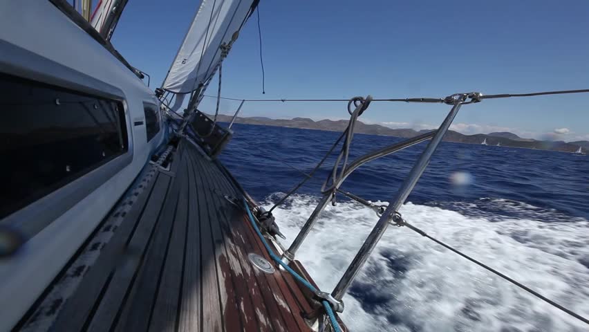 Mixed shots: Sailing in the wind through the waves (HD) Sailing boat shot in