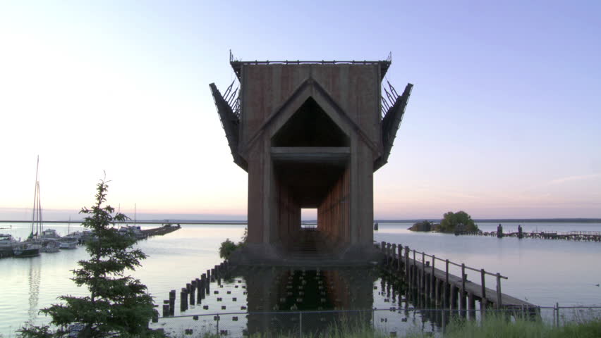 Locked off shot of disused ore dock, once used for filling large ships on the coast of Lake Superior, Marquette, Michigan, USA.  Recorded at dawn.