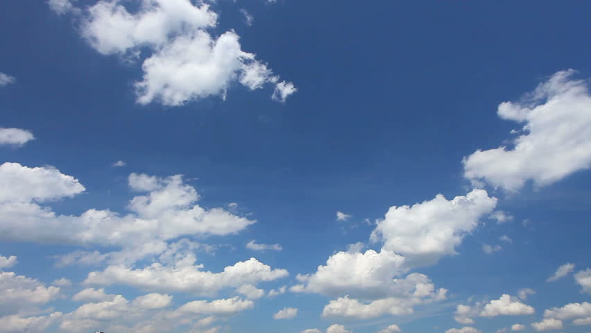 White Clouds moving throu blue sky