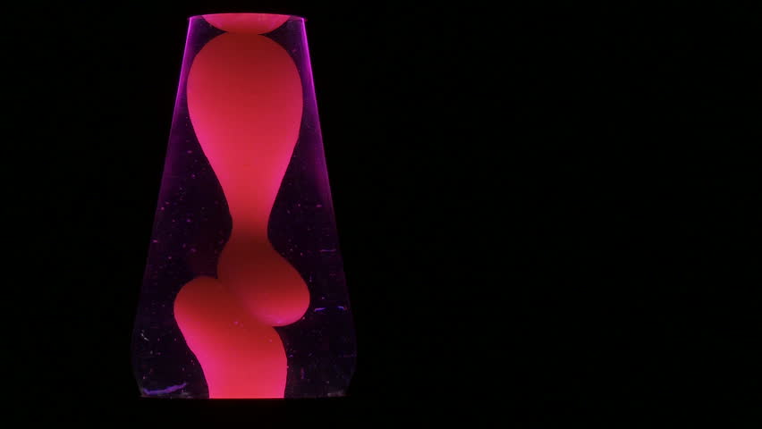 Red lava lamp, cropped tightly against a dark background.  Space at side for