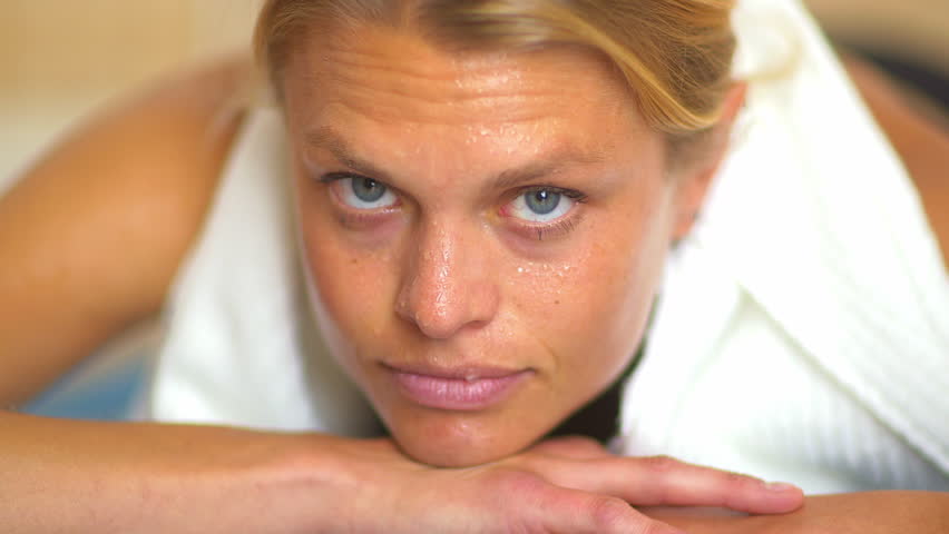 Close up portrait of sweaty woman during workout