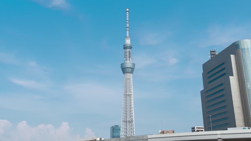 TOKYO, JAPAN - JULY. 26 : Time lapse zoom out of Tokyo Skytree and Metropolitan
