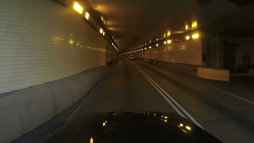 A high-angle perspective of driving into the Fort Pitt Tunnels leaving downtown