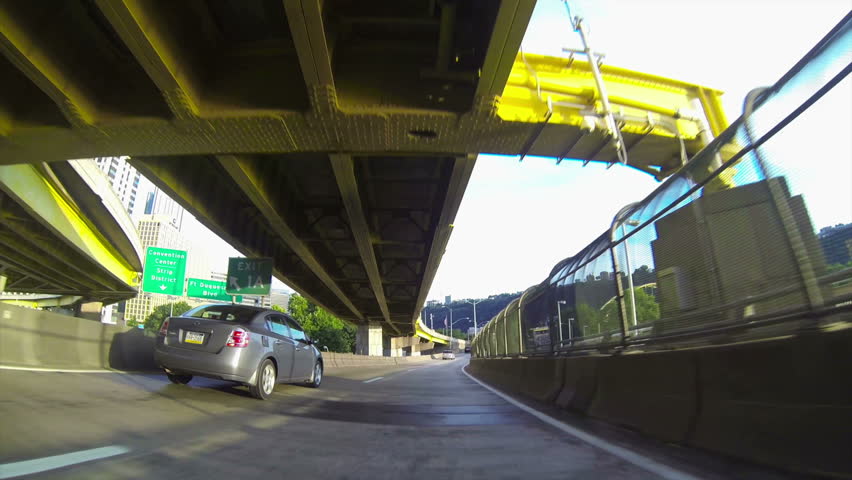 A low-angle perspective of driving into downtown Pittsburgh.
