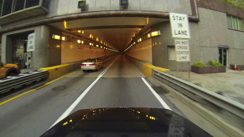 A high-angle perspective of driving into the Fort Pitt Tunnels leaving downtown